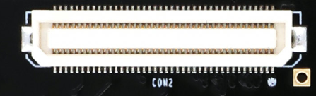 图片显示了一个CON2扩展口连接器的实物图，连接器的Pin1位置用圆点标示。连接器的引脚排列整齐，呈矩形排列，连接器的两侧有金属触点，中间部分为绝缘塑料部分。图片在文档中用于说明CON2扩展口连接器的实物形态，帮助读者更好地理解CON2扩展口的结构和布局。