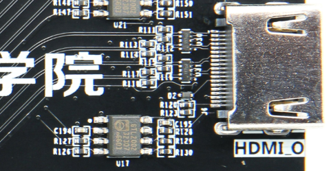 图片显示了AX7035开发板上的HDMI输出接口实物图。接口右侧标有“HDMI_O”，左侧有多个电子元件和电路板上的标识，如“U17”和“C194”。该图在文档中用于展示HDMI输出接口的实际外观，帮助读者更好地理解HDMI输出电路的布局和连接方式。